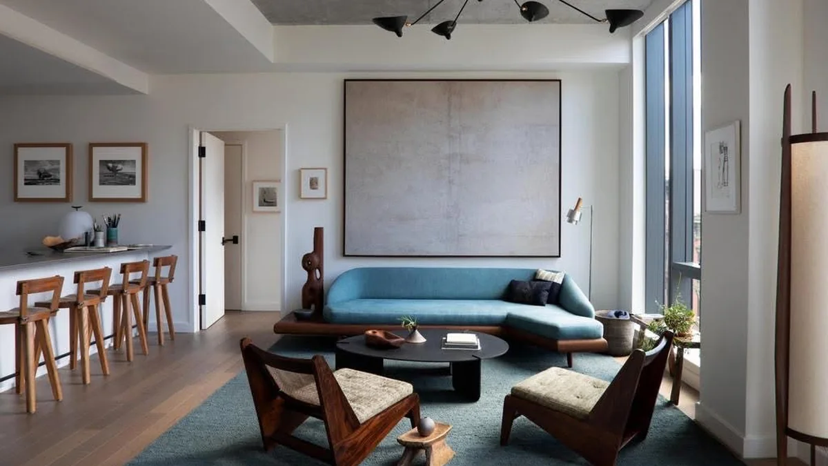 Two empty wooden chairs facing a coffee table in a calm room